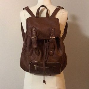 Brown backpack with copper details